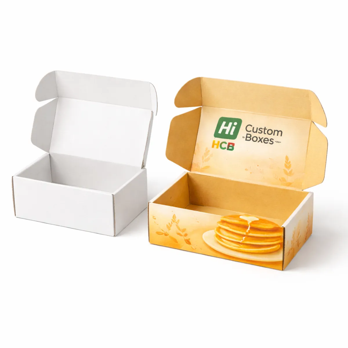 A stack of custom pancake boxes with colourful branding and a matte finish for takeaway service- class=